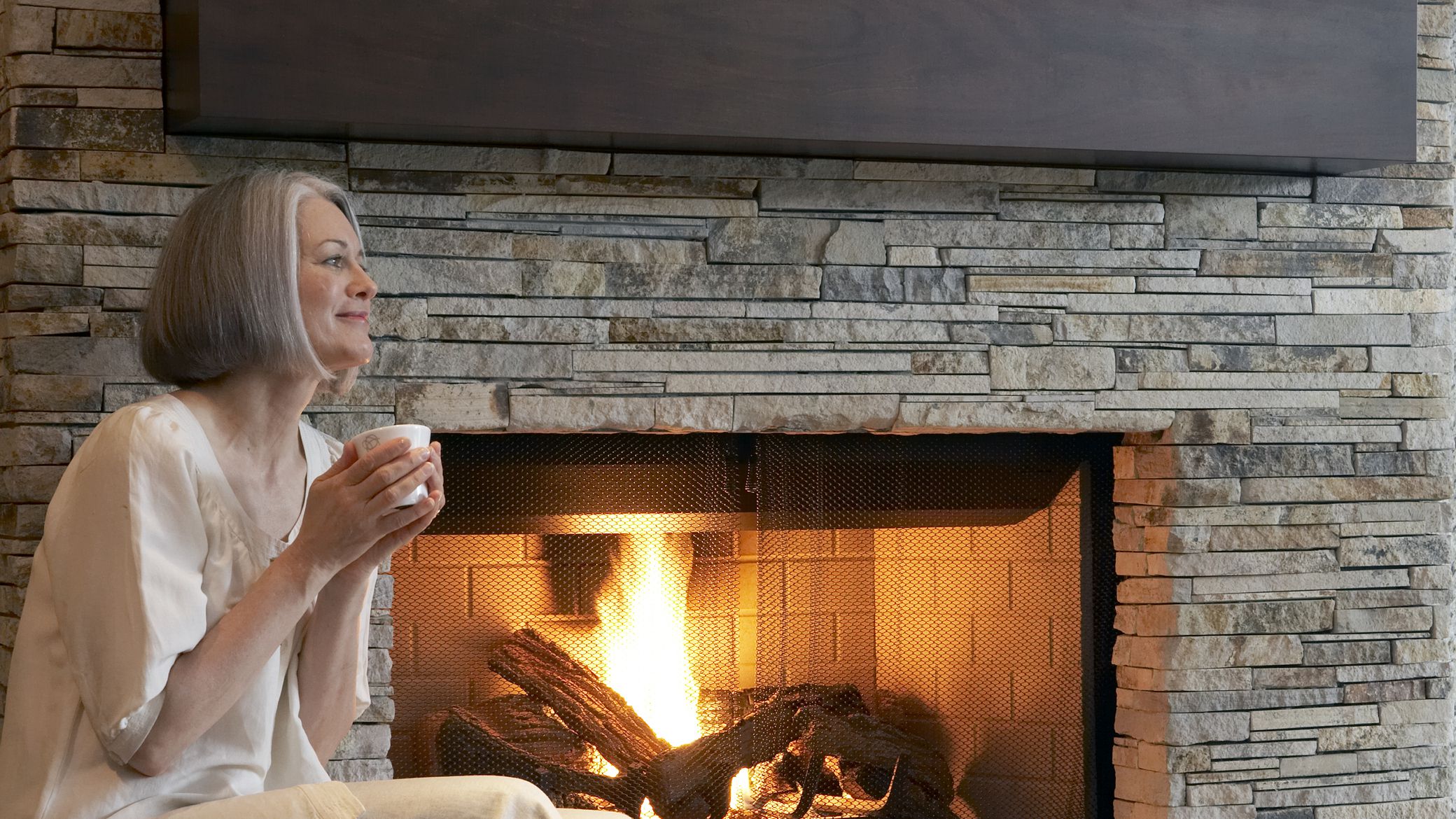 Can You Install Stone Veneer Over Brick Stone fireplace Getty sb f 001 58c21eca3df78c353c1551ba
