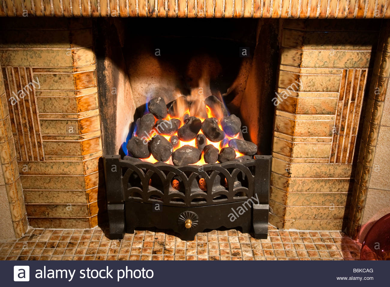 a gas coal effect fire burning in a grate B6KCAG