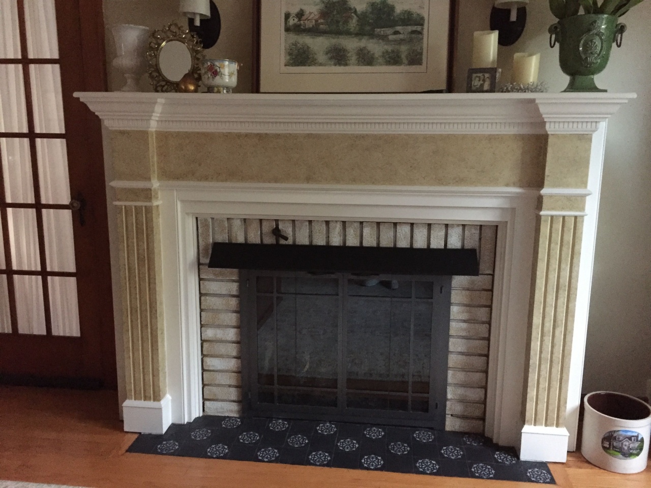 how to refinish a fireplace stencil over black tile just to jazz up the fireplace from how to refinish a fireplace