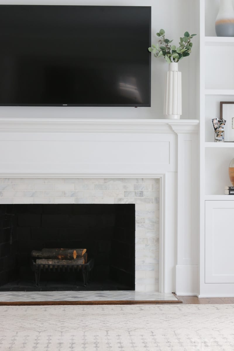 White Fireplace with Marble Tile