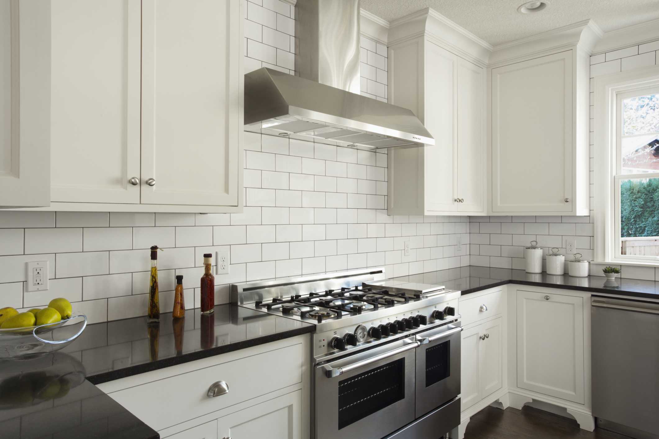 How Subway Tile Can Effectively Work in Modern Rooms Modern Kitchen With White Subway Tile 56a49fe65f9b58b7d0d7e2d4