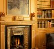 Fireplace Bookshelf Lovely View Of A Lit Fireplace Beside A Bookshelf Stock