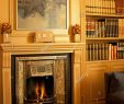 Fireplace Bookshelf Lovely View Of A Lit Fireplace Beside A Bookshelf Stock