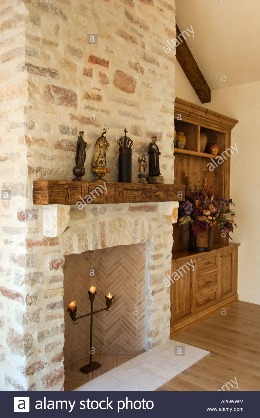 hard wood floor stone fireplace built in cabinets and statuary in A25WWM