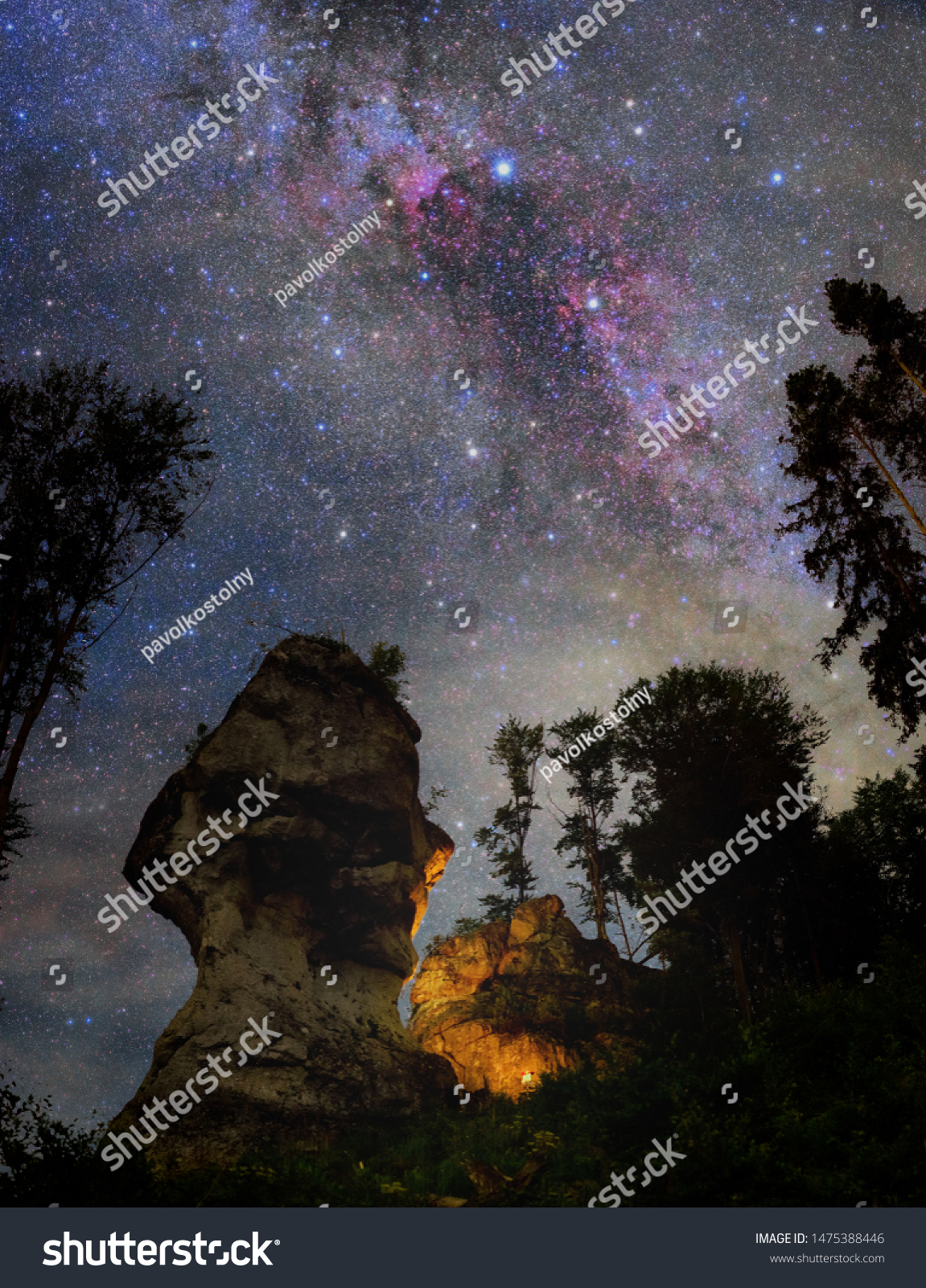 stock photo starry night dky over rocks with fireplace