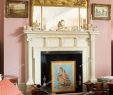 Fireplace Mirror Elegant ornate Gilt Mirror Above Neo Classical Fireplace with