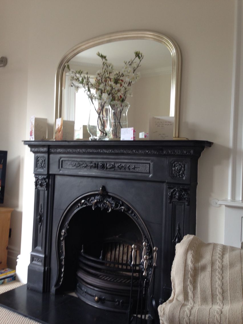 Beautiful iron fireplace with over mantle mirror above 2deb56f552d3e985c96bb518f6fd5e5a