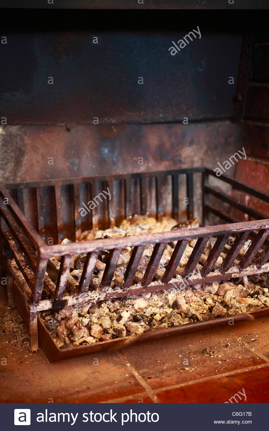 Fireplace A cast iron grate and coal tray in a brick lined fireplace a cast iron grate and coal tray in a brick lined hearth C6G17B
