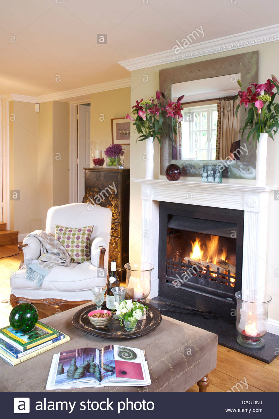 Fireplace Tray Beautiful White Armchair Beside Fireplace with Lit Fire In Country