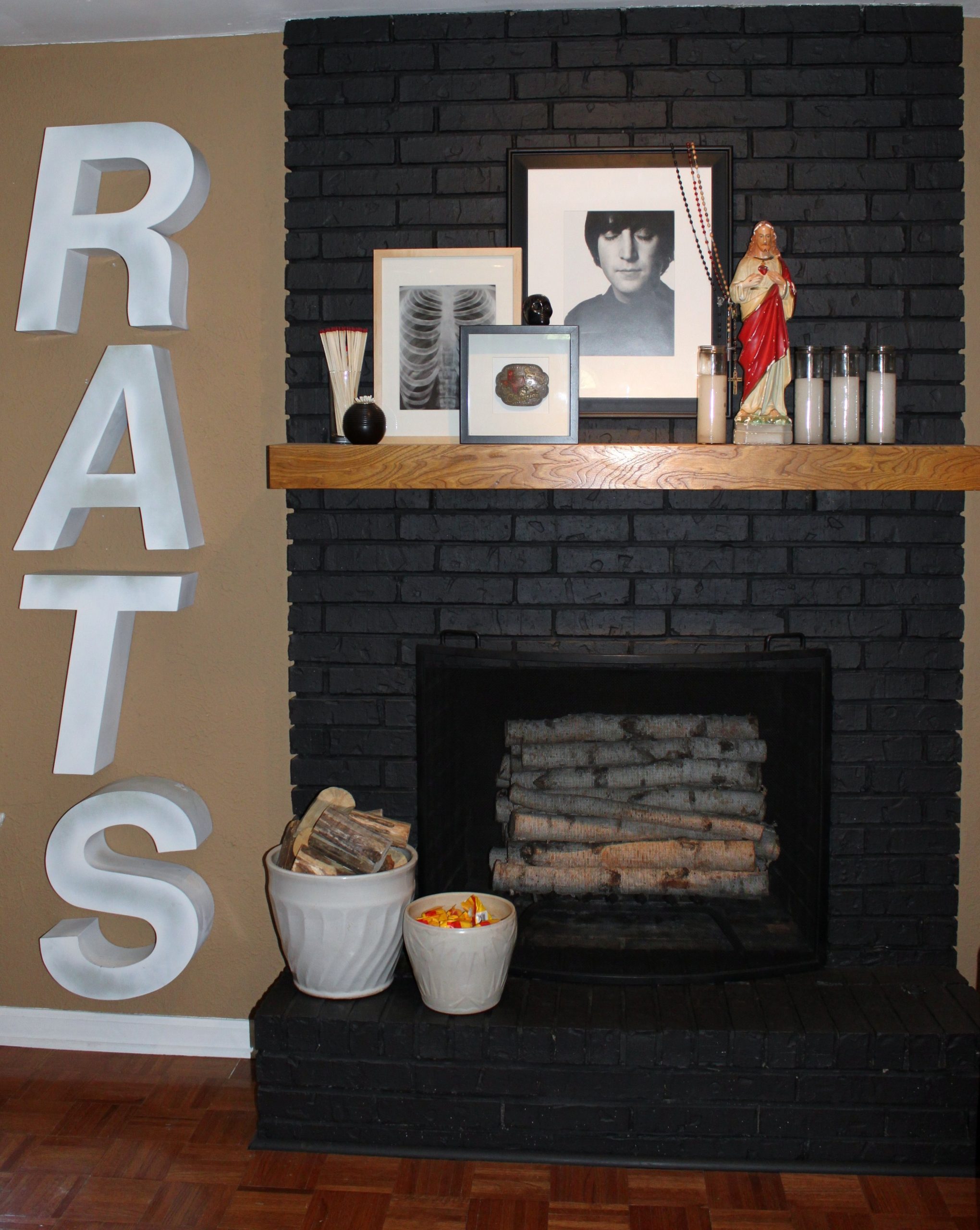 restoration hardware rats next to the mantle