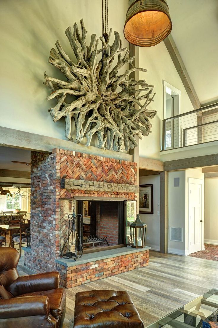 traditional living room yankee barn homes with brown leather sofa and brick wall fireplace plus hardwood flooring design natural home design by yankee barn homes barn homes floor plans