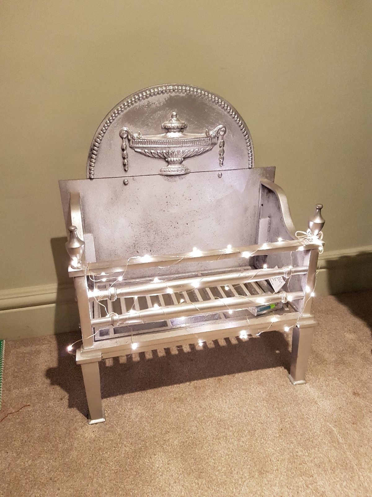 Silver ornamental fireplace grate 5cfbbc52af28cf5fa2756b17